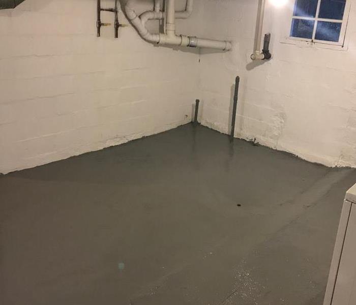 Concrete garage floor with standing water
